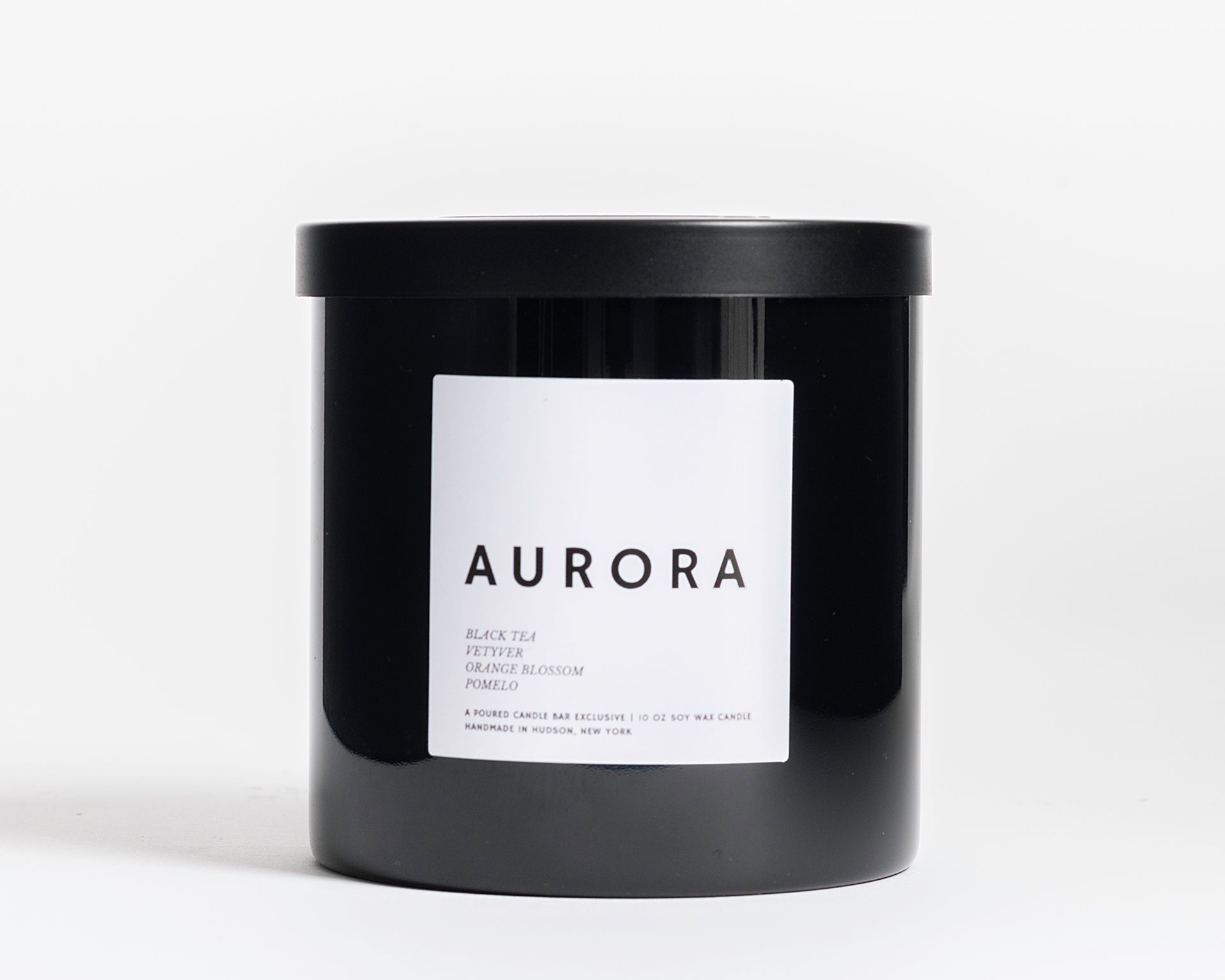 10 oz 100% soy wax candles in a black glass vessel. Profile Description: Faintly sweet + herbal, with subtle hits of white floral + citrus  Notes: Black Tea, Vetyver Root, Orange Blossom, Pomelo 