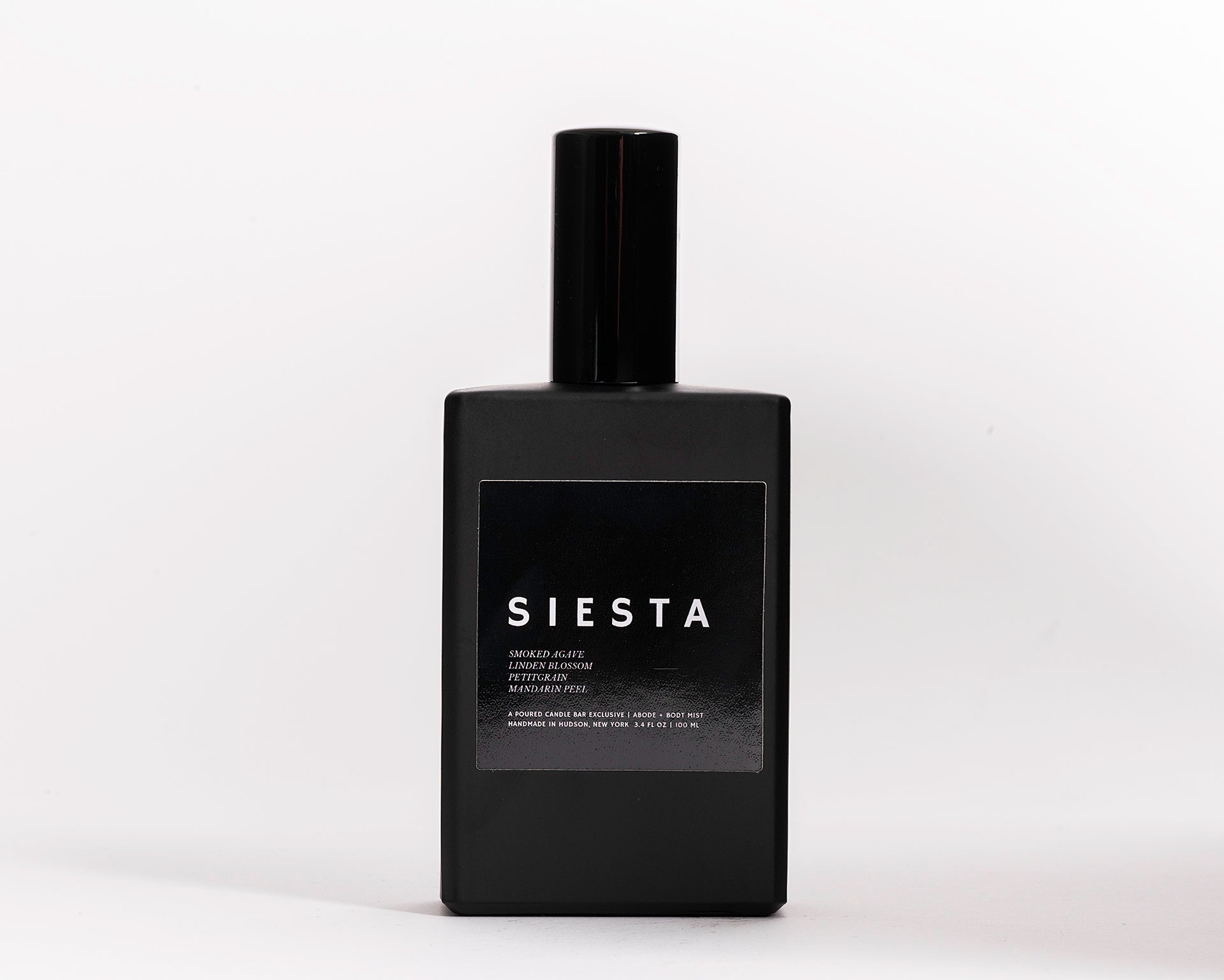 100 ml room spray in a black rectangular glass vessel. Profile Description:  Smoky + sweet with faint blossoms + citrus rind  Notes: Smoke, Agave, Linden Blossom, Petitgrain Oil, Mandarin Peel